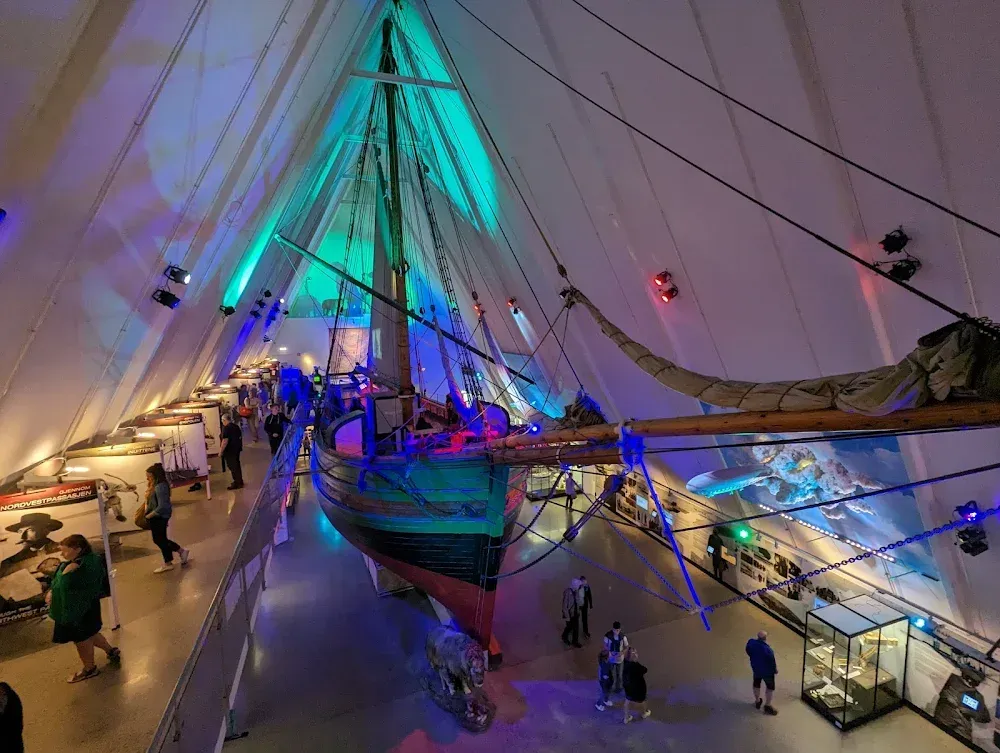 Interior of the Fram Museum in Oslo featuring the original ship “Gjøa” and an exhibition dedicated to the Northwest Passage and polar exploration.