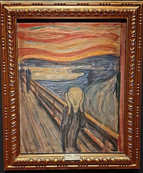 Edvard Munch’s iconic painting "The Scream" in a golden frame, displayed at the National Museum in Oslo.