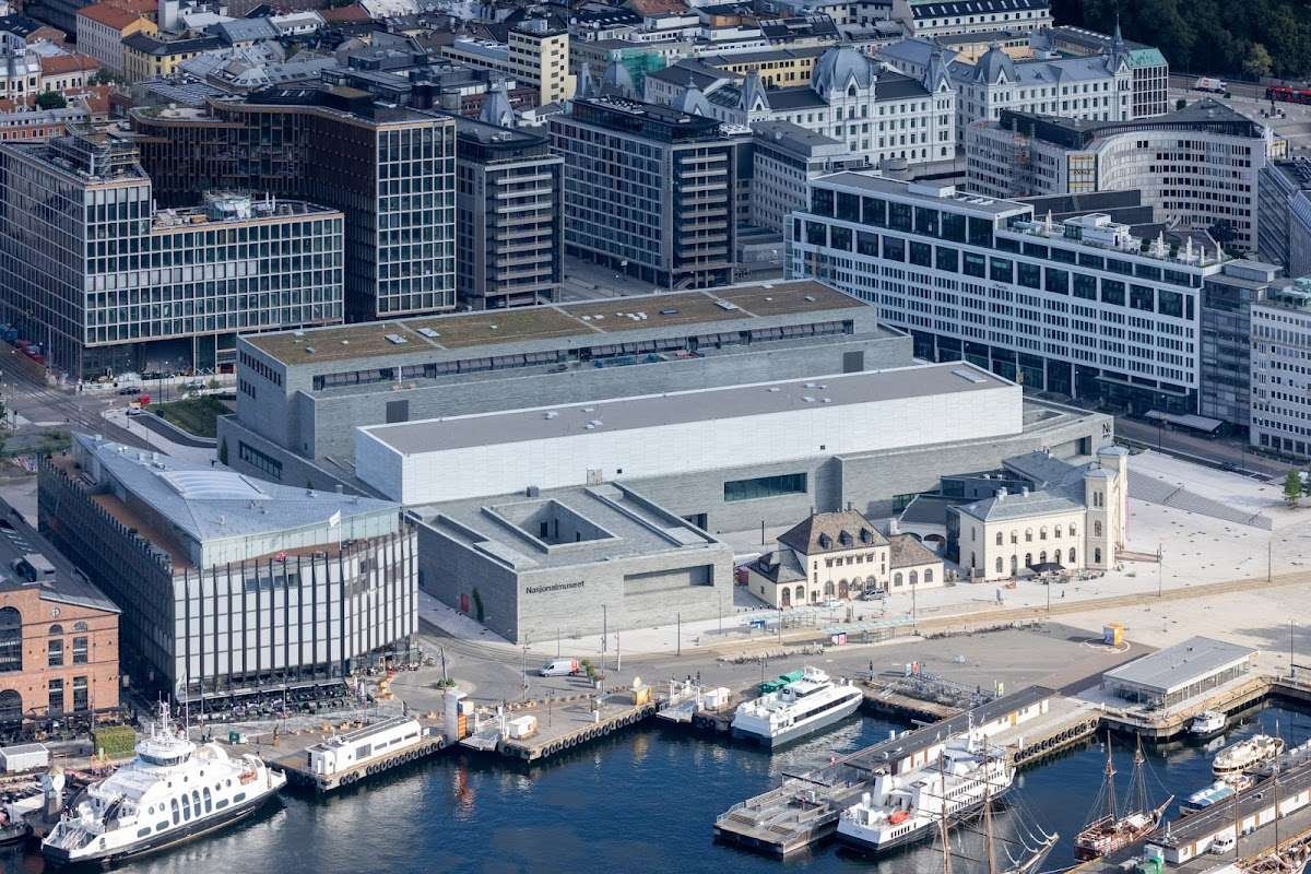 Aerial view of the National Museum of Norway in Oslo, a modern waterfront building with adjacent historic structures.