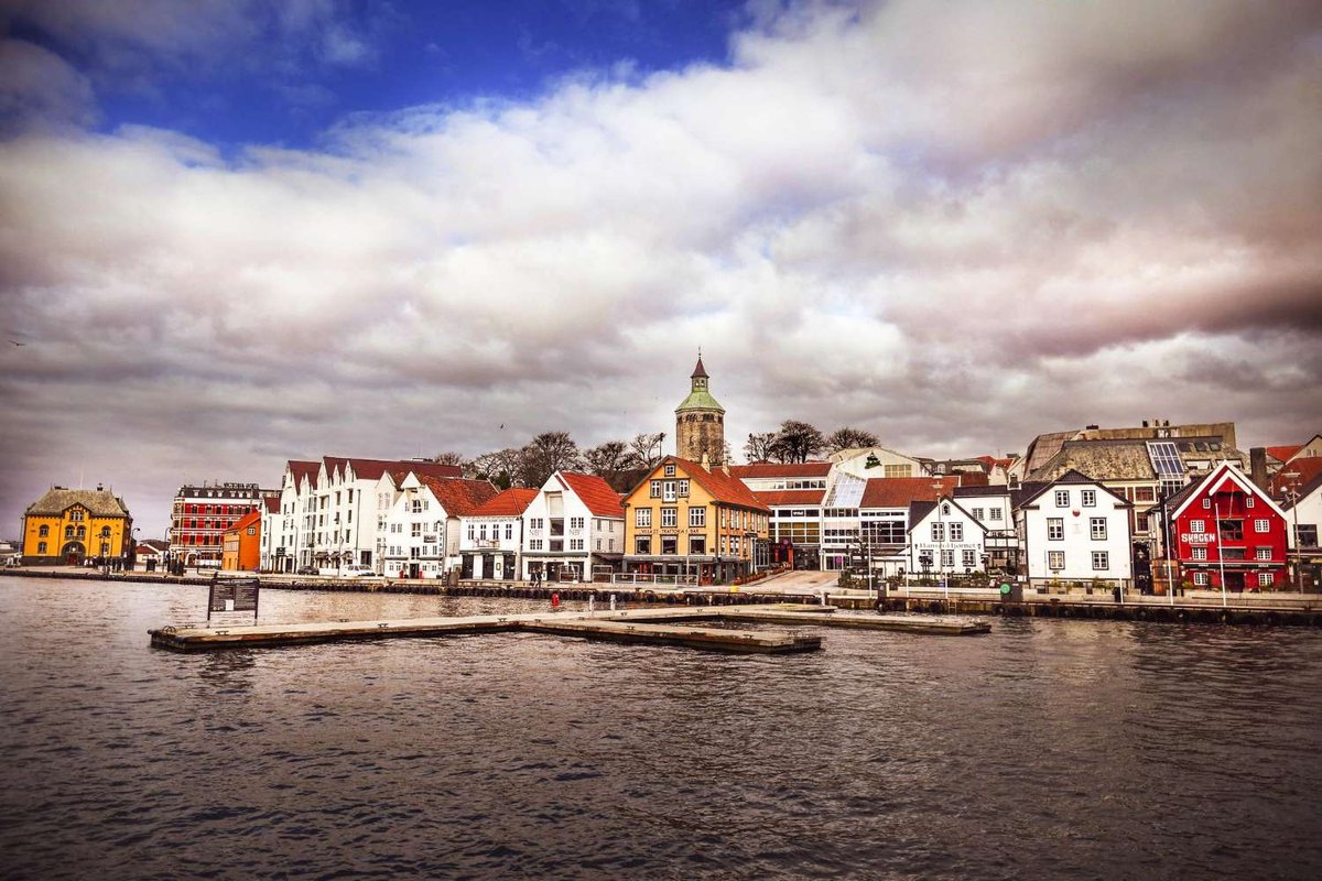 The historic center of Stavanger with traditional wooden houses along the waterfront.