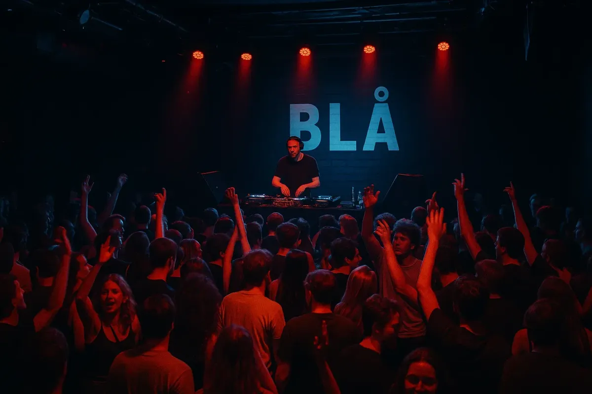 A lively night scene at Blå club in Oslo with people dancing and colorful stage lights