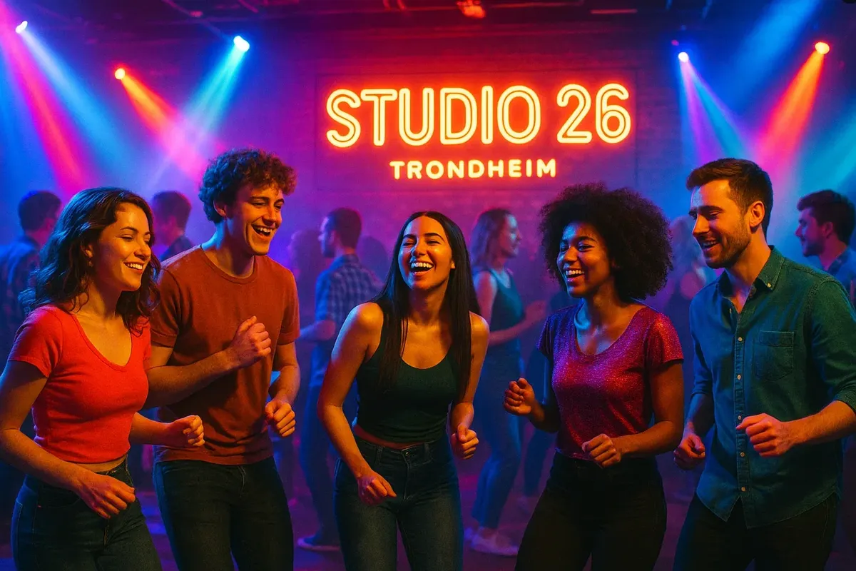 A fun student crowd dancing at Studio 26 in Trondheim under bright club lights