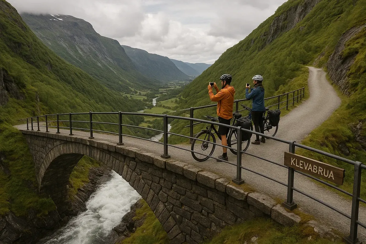 View of Klevabrua bridge on Rallarvegen with cyclists stopping to take photos of valley below