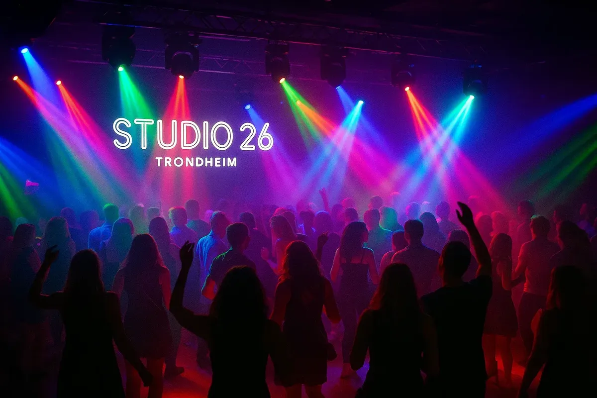 Lively night inside Studio 26 in Trondheim with vibrant lighting, dancing people, and DJ booth